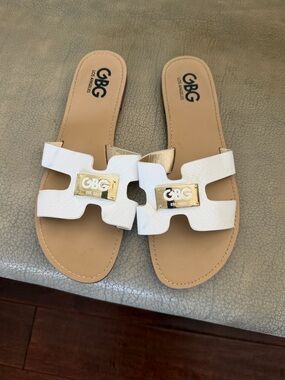 GBG Los Angeles White Slide Sandals with Gold Logo Plaque